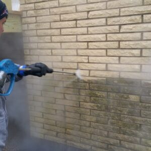 Photo of Powerhouse Pete power washing bricks
