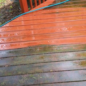 Photo of a red patio deck being soft washed and showing before and after
