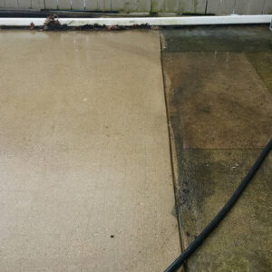 Photo of a concrete patio being hot washed