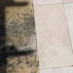 Photo of before and after concrete cleaning