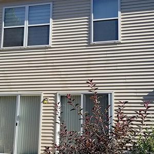 After photo of the back of a home with vinyl siding that was washed clean