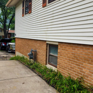 Photo of a residential house vinyl siding after being soft washed