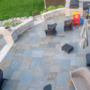 Photo of a large outdoor living area brick paver patio after being power washed