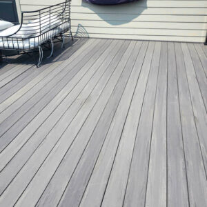 Photo of a gray deck after being cleaned